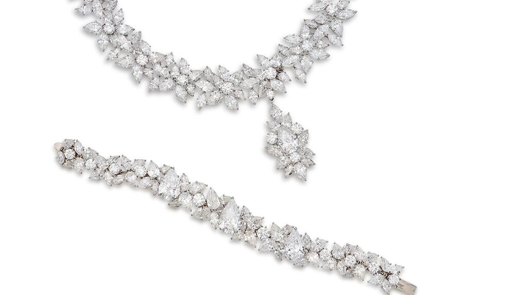 A Harry Winston cluster-style necklace set with round, pear- and marquise- shaped diamonds estimated to sell for $700,000 to $1 million, and a Harry Winston bracelet of a similar design with an estimate of $650,000 to $850,000 Harry Winston wreath necklace and bracelet